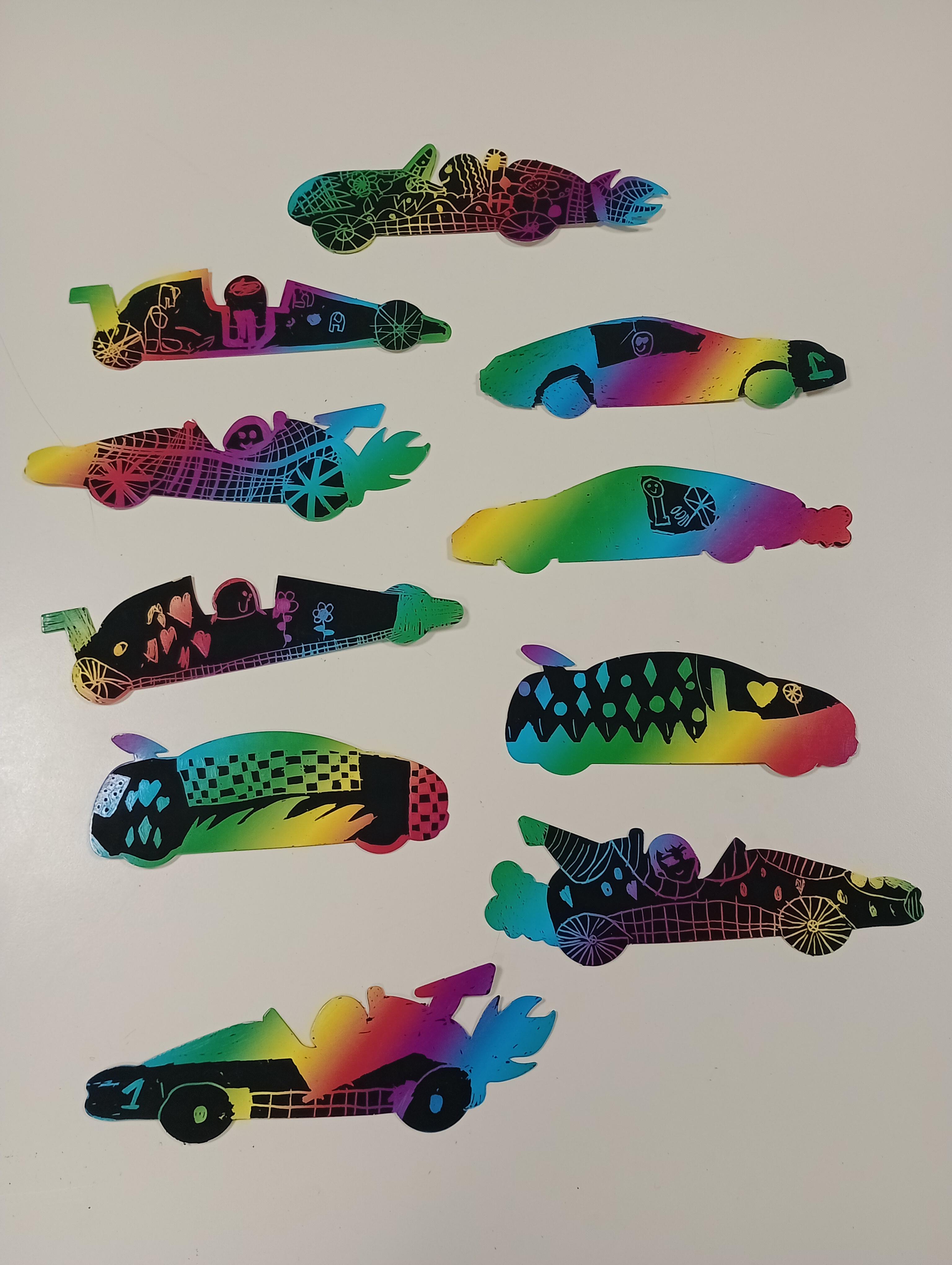 The children made racing car scratch art magnets after their breakfast. 